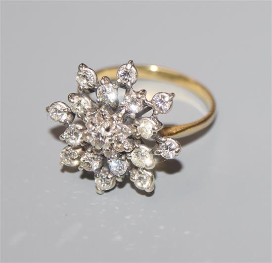 A yellow metal and diamond set snowflake cluster ring, size O.